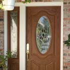 This old white door was replaced with a wood grain solid core fiberglass entry door system with triple pane glass.