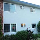 Able Glass changed these window old, single pane, aluminum, and drafty windows in this apartment complex to energy efficient, double pane, Milgard white Styleline™ Series vinyl windows.