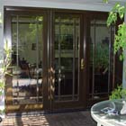 This was an old single pane patio door before we installed the new Milgard® WoodClad™ Series bronze exterior fiberglass French door.